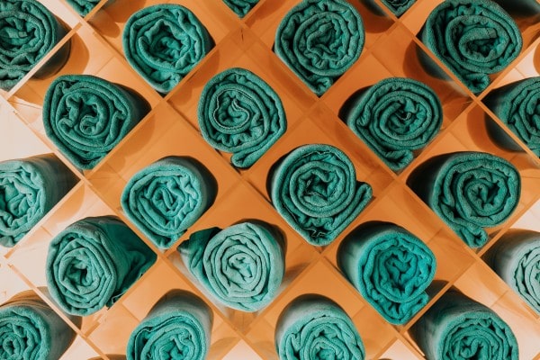 rolled up green spa towels